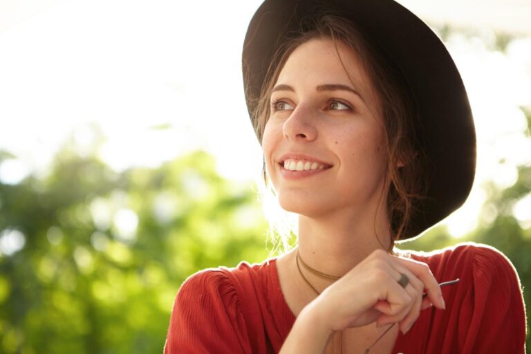 Smiling girl wearing a black hat